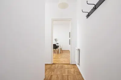 an open door to a dining room with a table at 1-Bedroom Apartment with Balcony - Długa 65 in Kraków