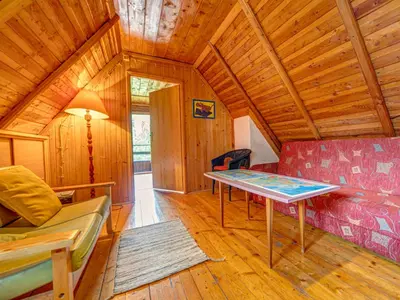 a room with a table in the middle of a room at Holiday Home Hatale by Interhome in Rzyki
