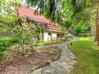 a house with a stone path in front of it at Holiday Home Hatale by Interhome in Rzyki
