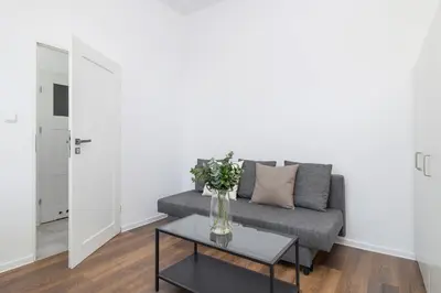 a living room with a couch and a table at 2-Bedroom Apartment - Długa 65 in Kraków