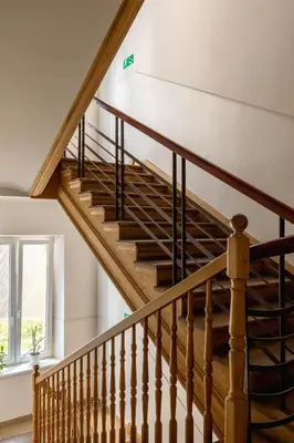 a winding staircase in a house with a window at 1-Bedroom Apartment - Długa 65 in Kraków