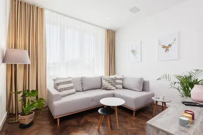a living room with a couch and a table at Apartment in the Old Town - Karmelicka Street in Kraków