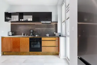 a kitchen with a sink and a stove at Apartment in the Old Town - Karmelicka Street in Kraków