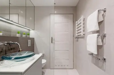 a bathroom with a sink and a toilet and a mirror at Karmelicka Street - Old Town in Kraków