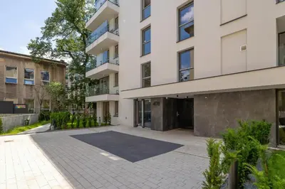 an empty courtyard in front of a building at Krowoderska Apartment with Balcony near City Center by Rent like home in Kraków