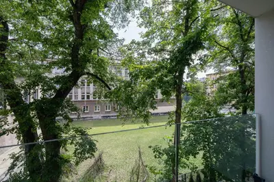 a view from a window of a building with a yard at Krowoderska Apartment with Balcony near City Center by Rent like home in Kraków