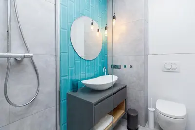 a bathroom with a sink and a toilet and a mirror at Old Town Apartment with Balcony - Rajska 3 Street in Kraków