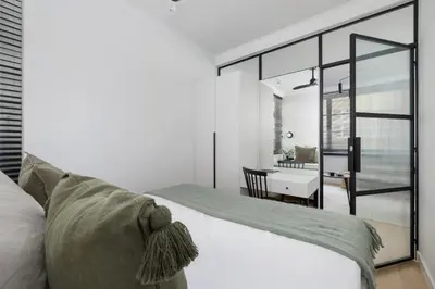 a bedroom with a bed and a desk in a room at 1-Bedroom Apartment - Sławkowska 6a Street in Kraków