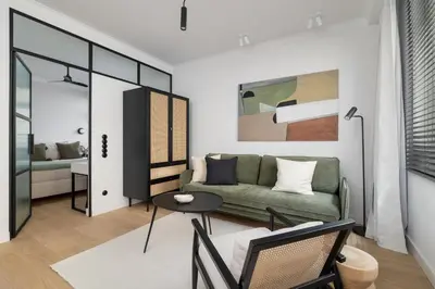 a living room with a couch and a table at 1-Bedroom Apartment - Sławkowska 6a Street in Kraków
