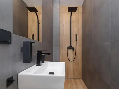 a bathroom with a white sink and a shower at Apartment in Kazimierz District - Starowislna 43 in Kraków