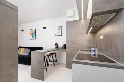 a kitchen with a sink and a counter top at Modern Apartment Old Town Cracow by Noclegi Renters in Kraków