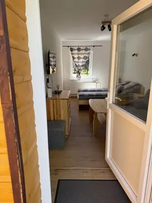 a view of a living room from the hallway at Gnapówka in Zawoja