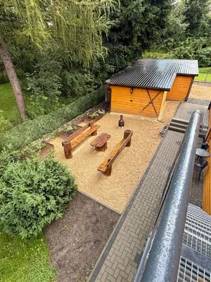 an overhead view of a park with benches and a building at Gnapówka in Zawoja