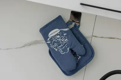 a blue tie with a design on it at Central Kraków Apartment by Noclegi Renters in Kraków