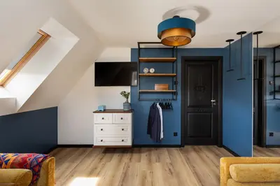 a living room with blue walls and a door at House for 20 people with a private SPA and bar Koma House in Sidzina
