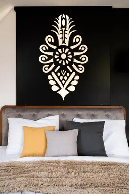 a bedroom with a bed with a black and white wall at House for 20 people with a private SPA and bar Koma House in Sidzina