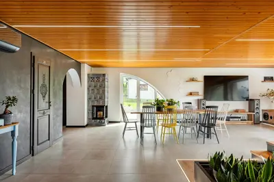 an open kitchen and dining room with a table and chairs at House for 20 people with a private SPA and bar Koma House in Sidzina