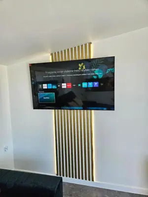 a flat screen tv hanging on a wall at TinyApartament in Skawa