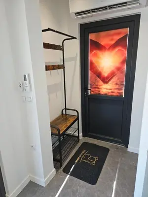 a room with a door with a heart painted on it at TinyApartament in Skawa
