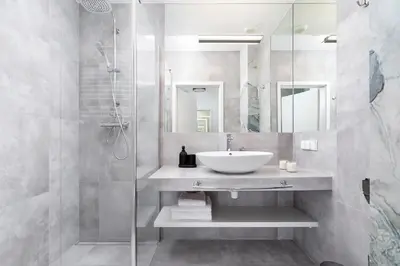 a bathroom with a sink and a shower at Studio for two with a balcony - Rajska 3 street in Kraków