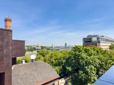 a view of a city from the roof of a building at Nadwiślańska Przystań Apartament z widokiem na Wisłę in Kraków
