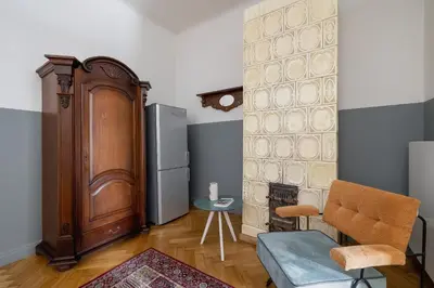 a living room with a couch and a refrigerator at 2 bedroom apartment Św Jana - Main Square in Kraków