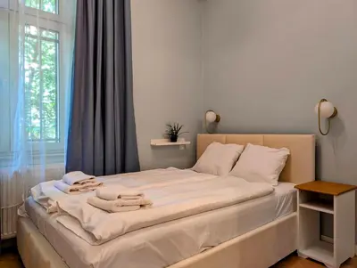 a bedroom with a bed with towels on it at Dębowa 4 by Homeprime in Kraków