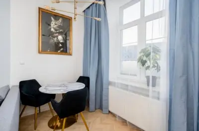 a room with a table and two chairs and a window at Dębowa 4 by Homeprime in Kraków