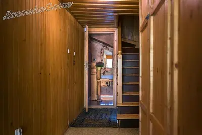 an empty hallway with a staircase in a house at Prawdziwy domek w górach in Nowy Targ