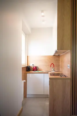a small kitchen with a sink and a counter at Apartament Słoneczny Rabka Zdrój in Rabka-Zdroj