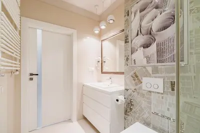 a white bathroom with a sink and a mirror at Apartment with Private Parking - Lubicz 17 street in Kraków
