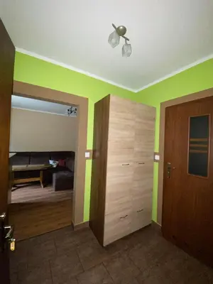 a room with green walls and a ceiling at Jelonek Zawoja in Zawoja