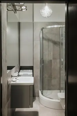 a bathroom with a shower and a sink and a toilet at Sight Main Square & Main Train Station & Planty in Kraków