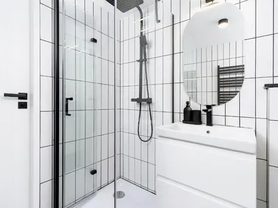 a white bathroom with a sink and a mirror at City center - Radziwiłłowska 27 in Kraków