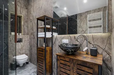 a bathroom with a sink and a toilet at Apartment with terrace - Skawińska 20 in Kraków