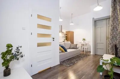 a living room with a couch and a table at Main Station - 8 Rakowicka Street in Kraków