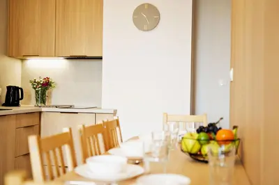 a dining room table with a bowl of fruit on it at Magic Apartments - Siena in Zator