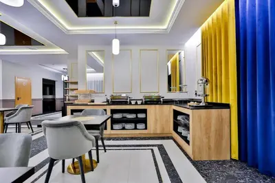 a kitchen with a table and chairs in a room at Kompleks Gazdówka - Dom Jana in Ponice