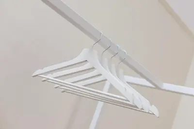 a white ceiling light hanging from a ceiling at 3-Bedroom Apartment - Rejtana 10 in Kraków