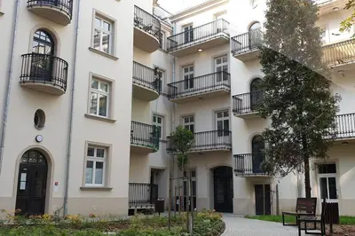 a building with balconies on the side of it at 1 - bedroom Apartment - Plac na Groblach 19 in Kraków