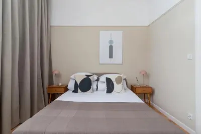 a bedroom with a bed with pillows at 2 - bedroom Apartment - Rejtana 10 in Kraków