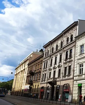 a group of buildings on a city street at Krakow Old Town Apartment in Kraków