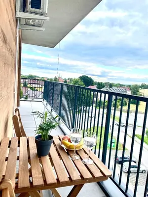 a wooden table with two glasses and a banana on a balcony at Sonja in Zator