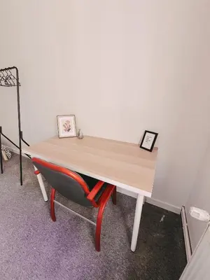 a bedroom with a bed and a table and a bed and a table sidx sidx at Cool and big room in Krakow in Kraków