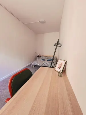 a room with a kitchen with a sink and a door at Cool and big room in Krakow in Kraków