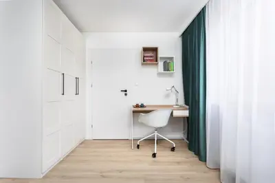 a home office with a desk and a chair at SOL Apartment in Kraków
