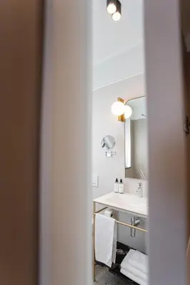 a bathroom with a sink and a mirror at Avanti Villa in Kraków