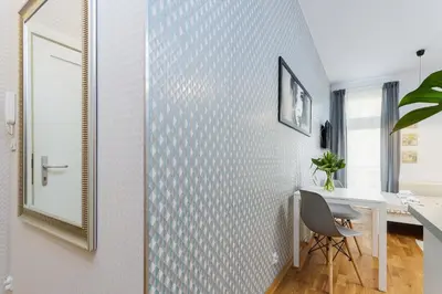 a home office with a desk and a mirror at Apartment with balcony - Rzeszowska 4 Street in Kraków