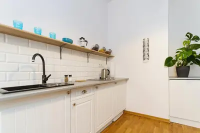 a kitchen with a sink and a counter top at Apartment with balcony - Rzeszowska 4 Street in Kraków