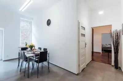 a dining room with a table and chairs at Apartment with balcony - 21 Filipa Street in Kraków